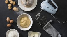 Smeg 50's Retro Hand Mixer laid out with baking ingredients