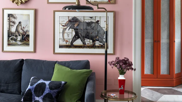 Beata Heuman interior design tips, living room with an art wall and pink paint