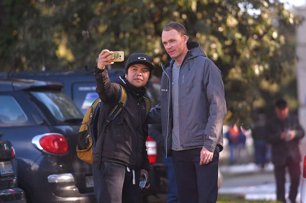 Chris Froome poses for a selfie with a fan