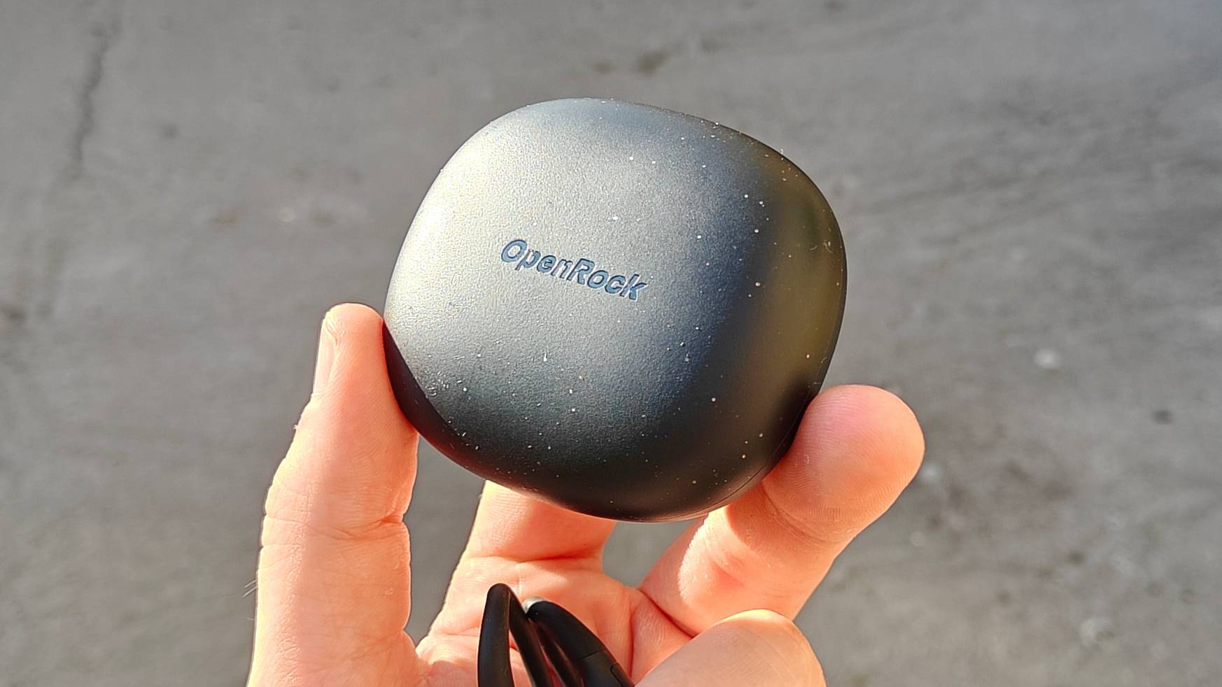 The OpenRock S2 in a man's hands