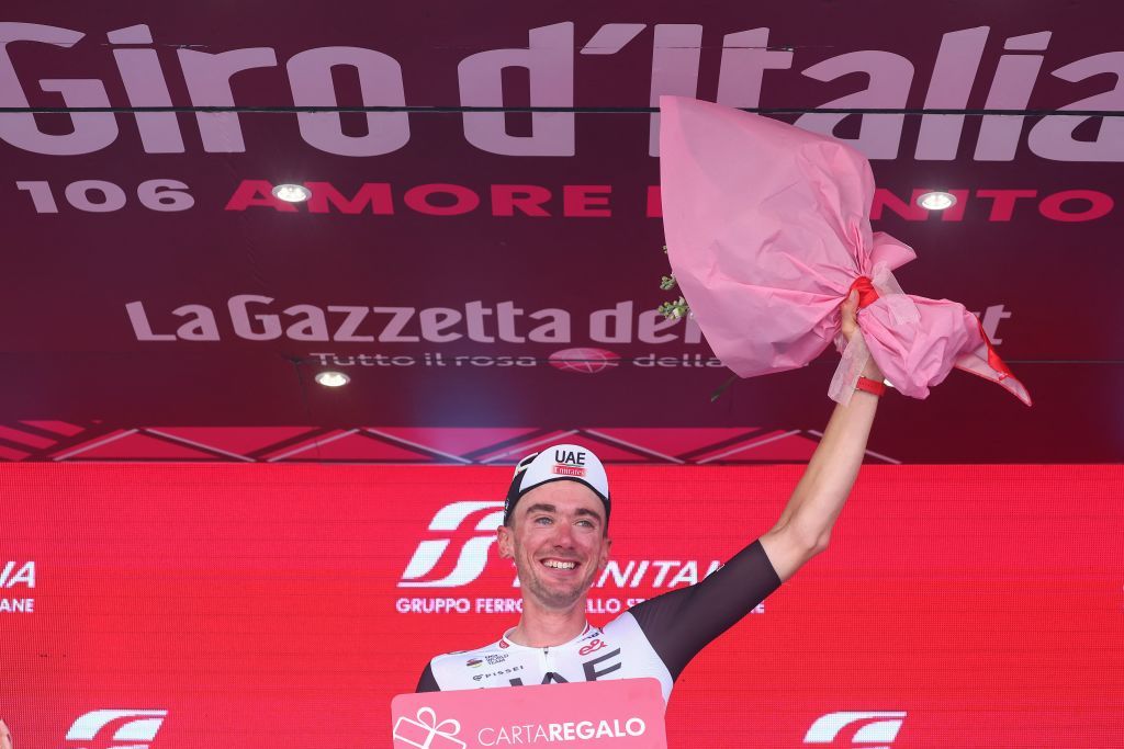 UAE Team Emirates US rider Brandon McNulty celebrates on the podium after winning stage 15