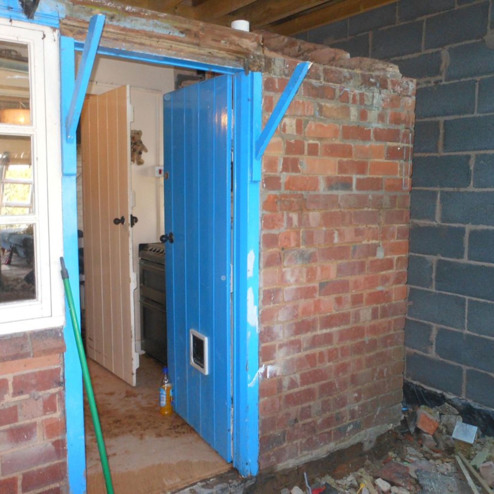 External door of a run-down cottage during the renovation