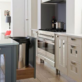 kitchen with range cooker and pull out bin