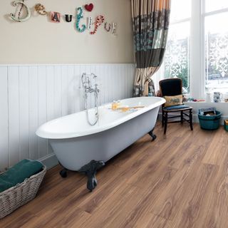 Wooden vinyl flooring with white bathtub