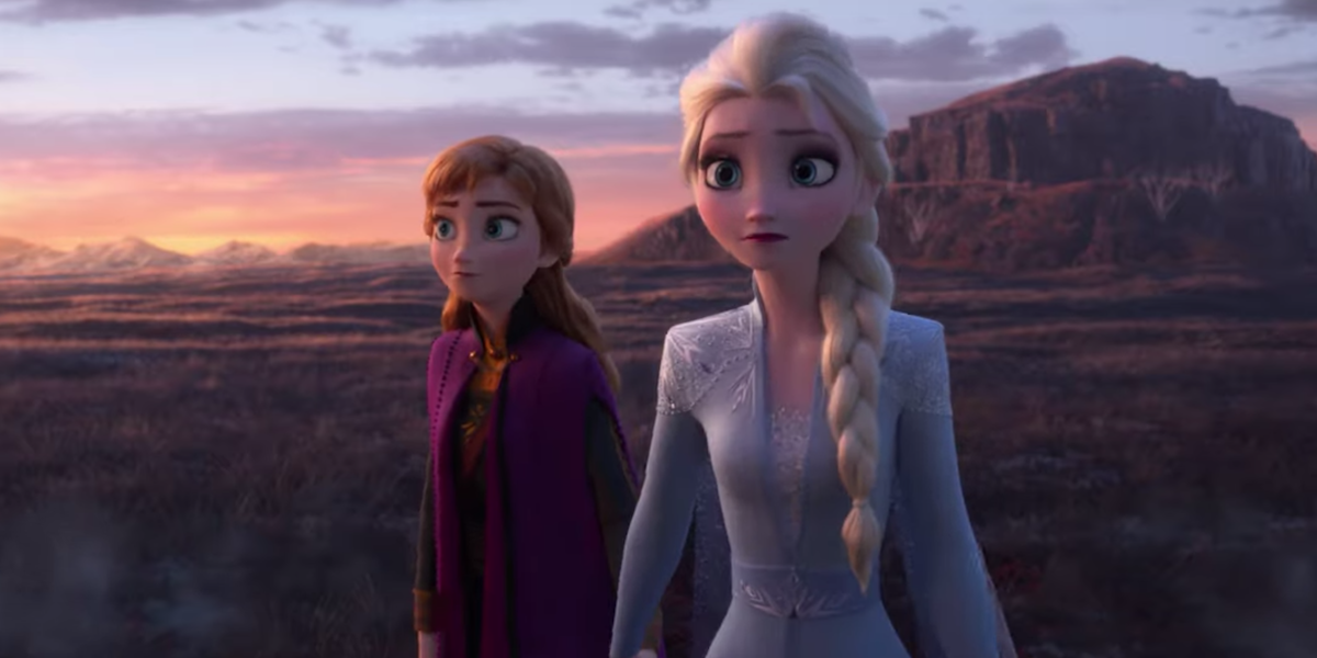 Anna and Elsa stand outside and look wary in a scene from &#039;Frozen II&#039;