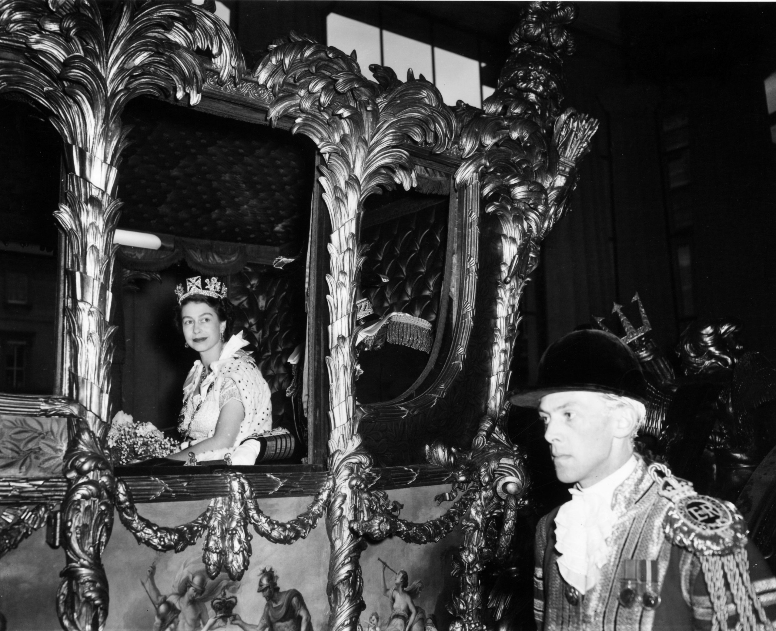 Queen Elizabeth riding in a carriage to her coronation