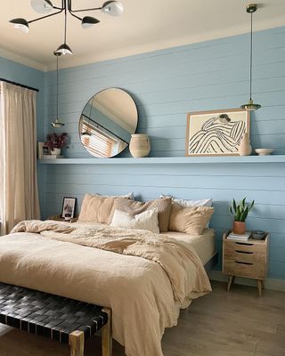 Bedroom with light blue accent wall