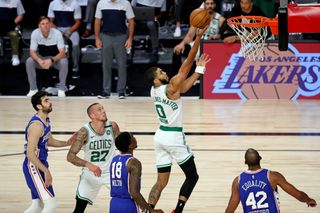 Jayson Tatum #0 of the Boston Celtics drives to the basket past Shake Milton #18 of the Philadelphia 76ers during the second half in Game Three of the first round of the NBA Playoffs at The Field House at ESPN Wide World Of Sports Complex on August 21, 2020 in Lake Buena Vista, Florida