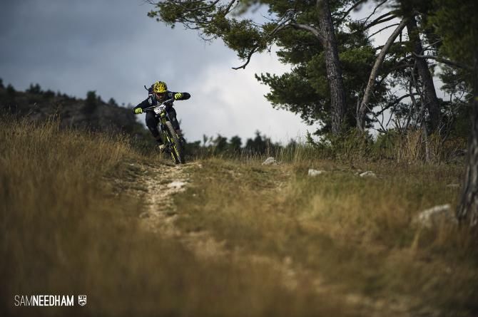 A rider flies through a timed section