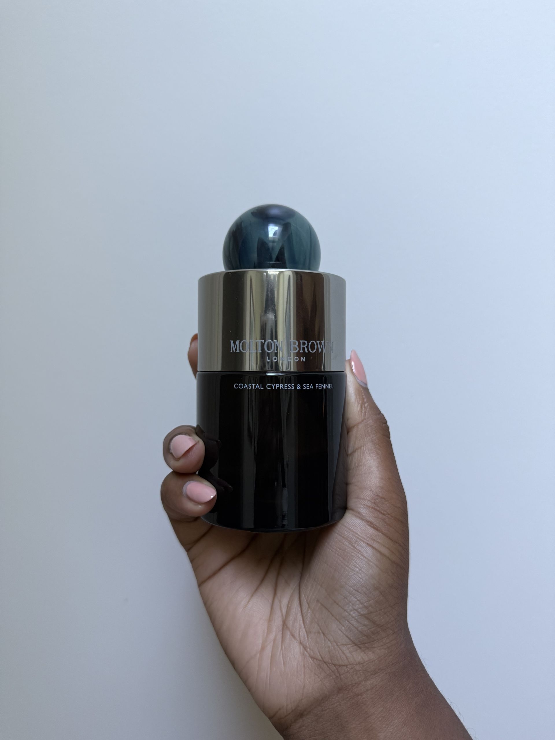 Photo of Maya Thomas testing Molton Brown's Coastal Cypress & Sea Fennel Eau de Parfum