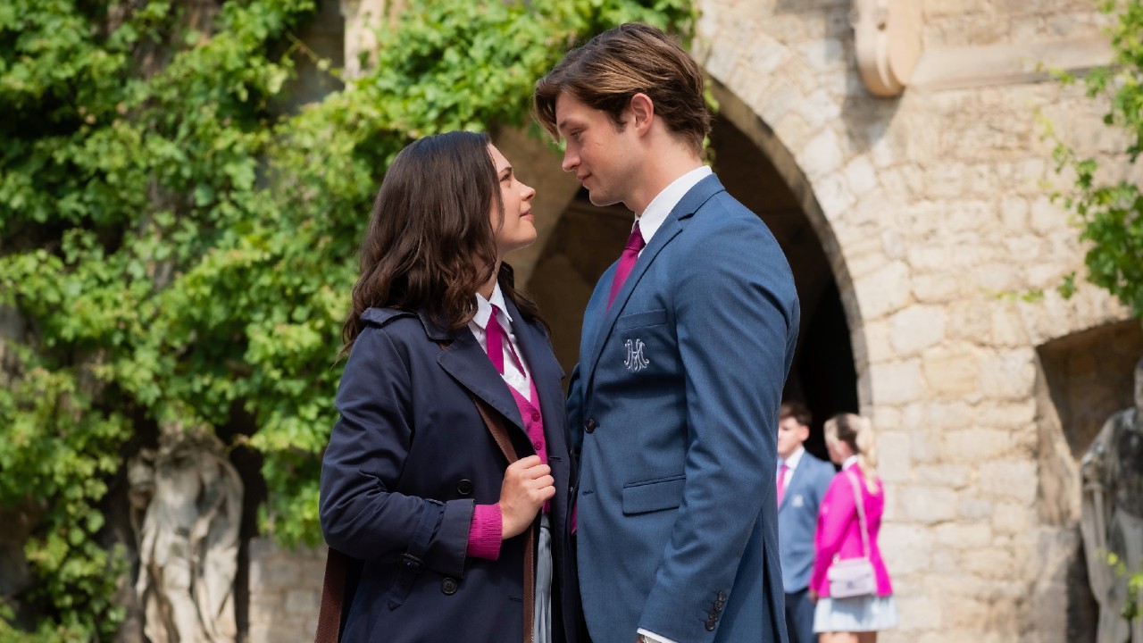 From left to right: Ruby standing and looking at James who is standing right next to her and looking into her eyes. 