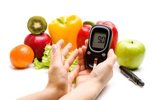 Fruits and vegetables, and a blood sugar monitor. 