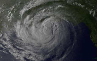 In waning daylight, a satellite snapped Hurricane Isaac at 6:46 p.m. local time as the massive storm made landfall at Plaquemines Parish, about 95 miles (153 km) east of New Orleans.