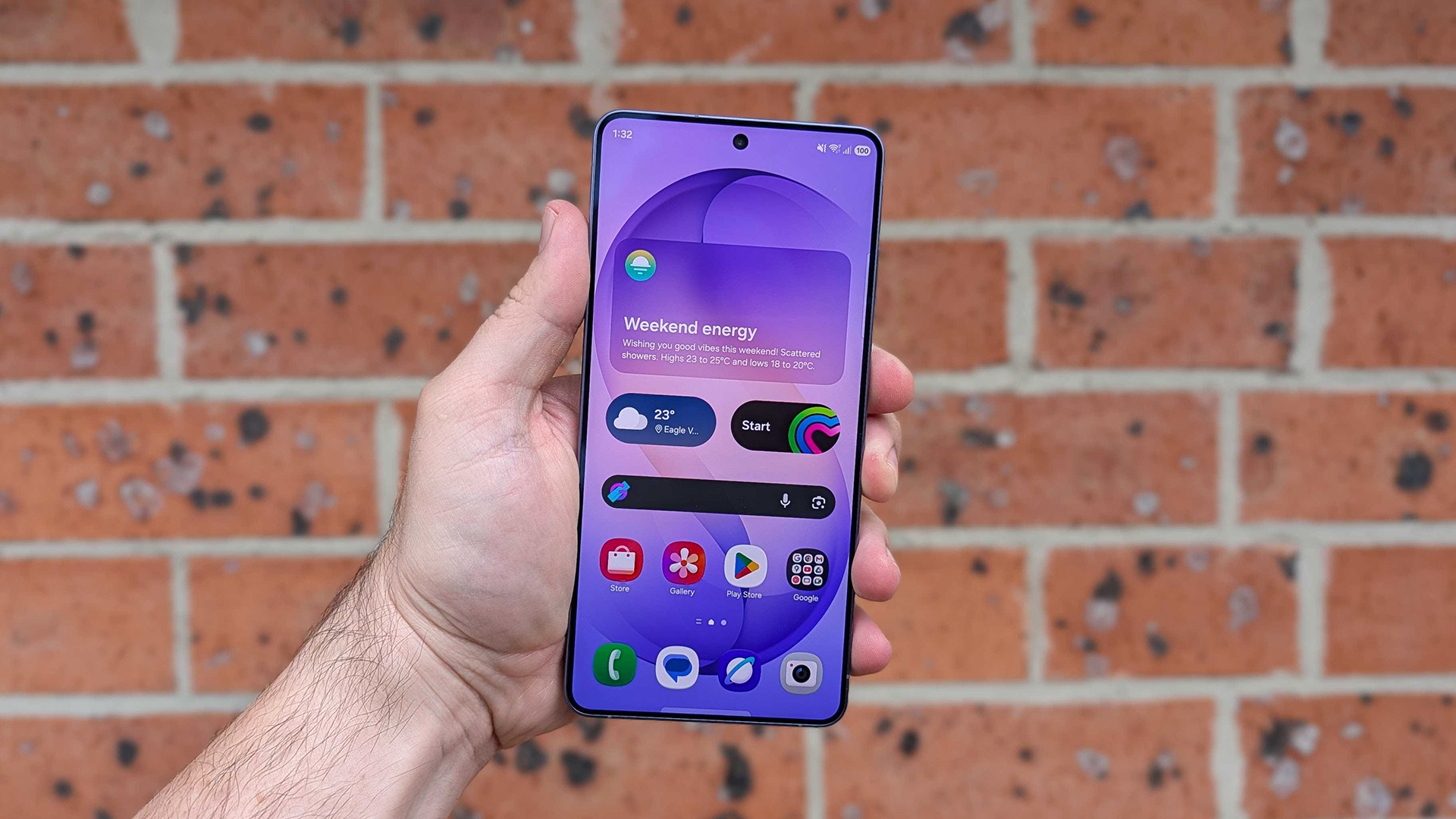 Front view of Samsung Galaxy S26 Ultra held up against a brick wall