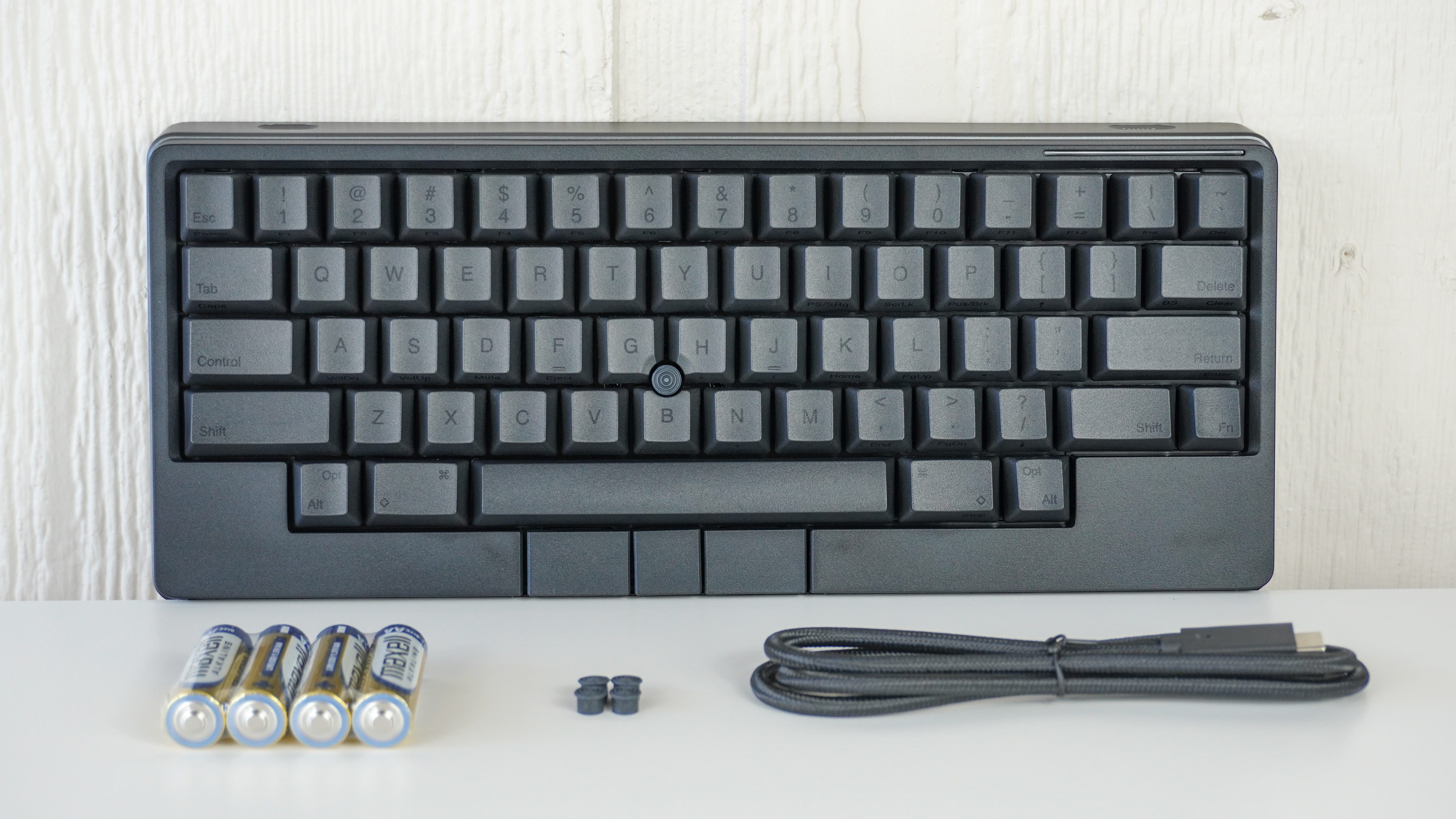 The HHKB Studio keyboard unboxed on a white desk
