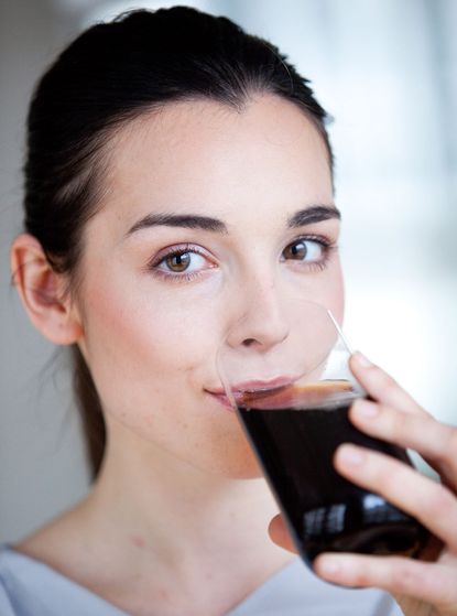 Woman drinking cola