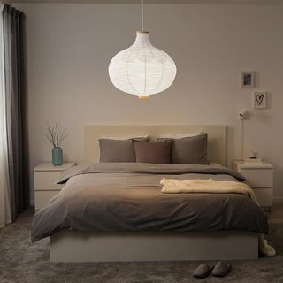 paper lampshade with bed and side table