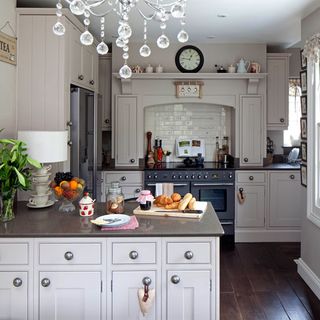 white kitchen with drawers and cookpot
