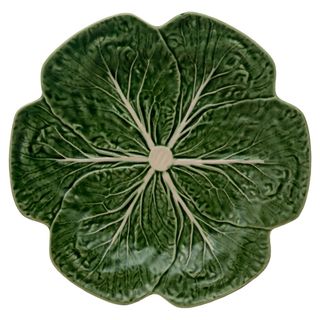 top angle view of a green plate in the shape of a cabbage