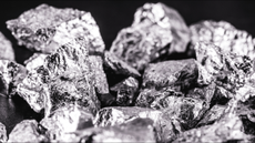 Iridium photographed on a black surface. Iridium is a metallic chemical element belonging to the class of transition metals, silver. Used in high strength alloys that can withstand high temperatures