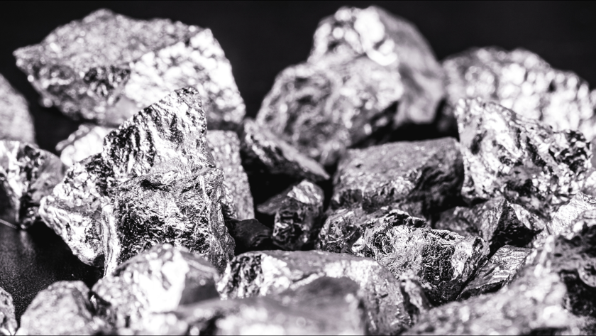 Iridium photographed on a black surface. Iridium is a metallic chemical element belonging to the class of transition metals, silver. Used in high strength alloys that can withstand high temperatures