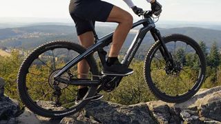 Man riding Porsche eBike Cross