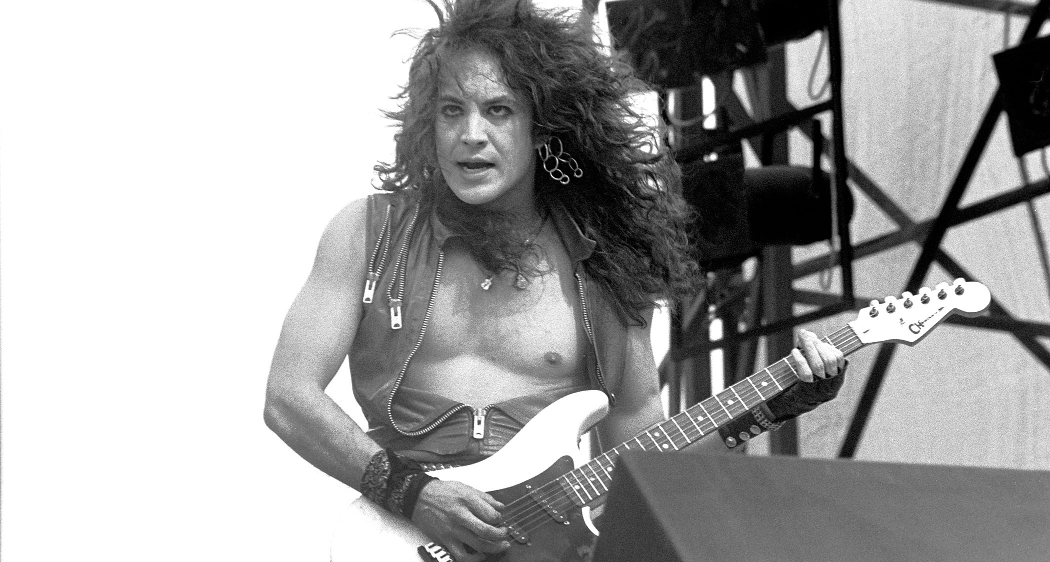 Jake E Lee, shirtless, in the throes of passion playing live with Ozzy in the &#039;80s with his signature Charvel S-style.