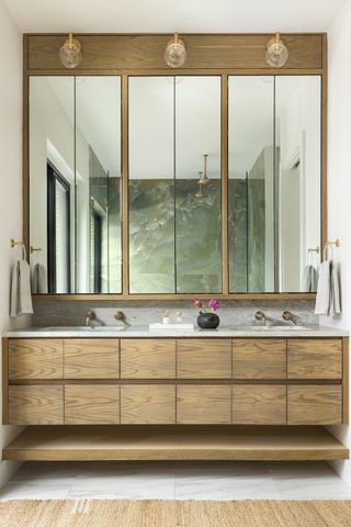 modern bathroom with timber floating vanity, double basin and large mirror cabinets