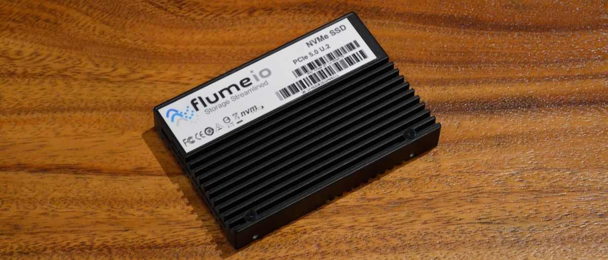 A FlumeIO F5900-series SSD on a wooden table