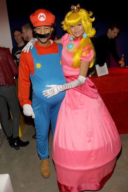 John Legend and Chrissy Teigen as Mario and Princess Peach