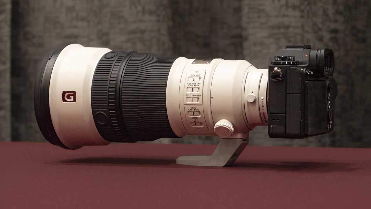 Sony FE 300mm F2.8 GM OSS lens on a red table
