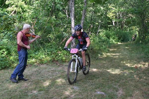The fiddler of New Hampshire serenades a passing rider