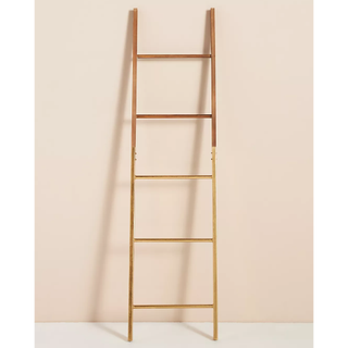 wooden and gold ladder towel rack
