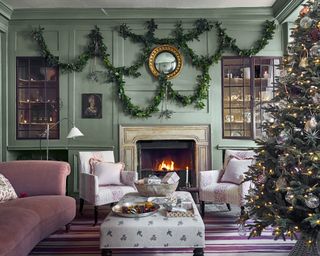 Christmas wall decor with layered foliage garlands in a living room