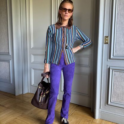 blanca miro wears a pair of stouls suede trousers and a striped top