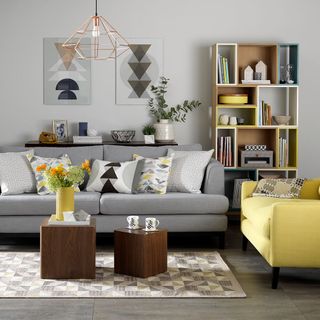 living room with shelves and sofa set