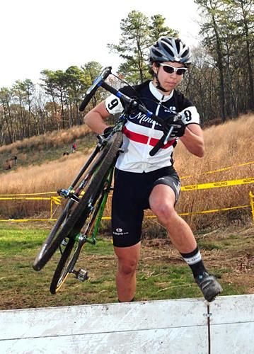 Anna Barensfeld (Minuteman Road Club) running the barriers.
