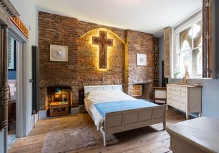 bedroom made with brick wall and wooden window shutters