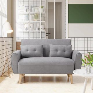 Gray two-seat loveseat on white background