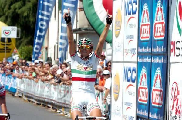 Filippo Pozzato (Katusha) points to the sky to remember Ballerini