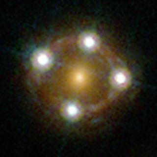 You saw the wide view, now here is the close-up. The quasar HE0435-1223 is seen here by the Hubble Space Telescope. It is one of the five best lensed quasars ever seen and appears as four nearly evenly spaced objects around a central galaxy that is actual