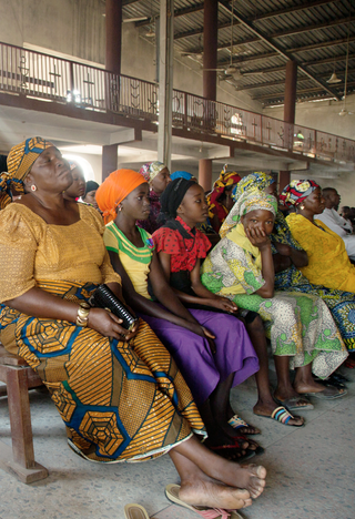 Christian women attend Sunday mass at a church in Mubi