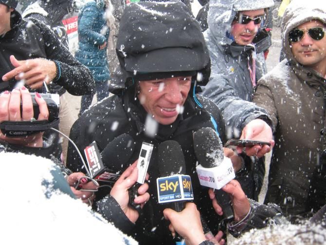 Amidst falling snow, Rigoberto Uran (Sky) speaks to the press after stage 20 at the Giro d'Italia