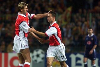 Marc Overmars is congratulated by Tony Adams after scoring for Arsenal against Lens in the Champions League in September 1998.