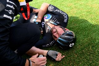 John Degenkolb (Team DSM) lies distraught on the ground of the Roubaix velodrome after crashing out of contention on Carrefour de l'Arbre