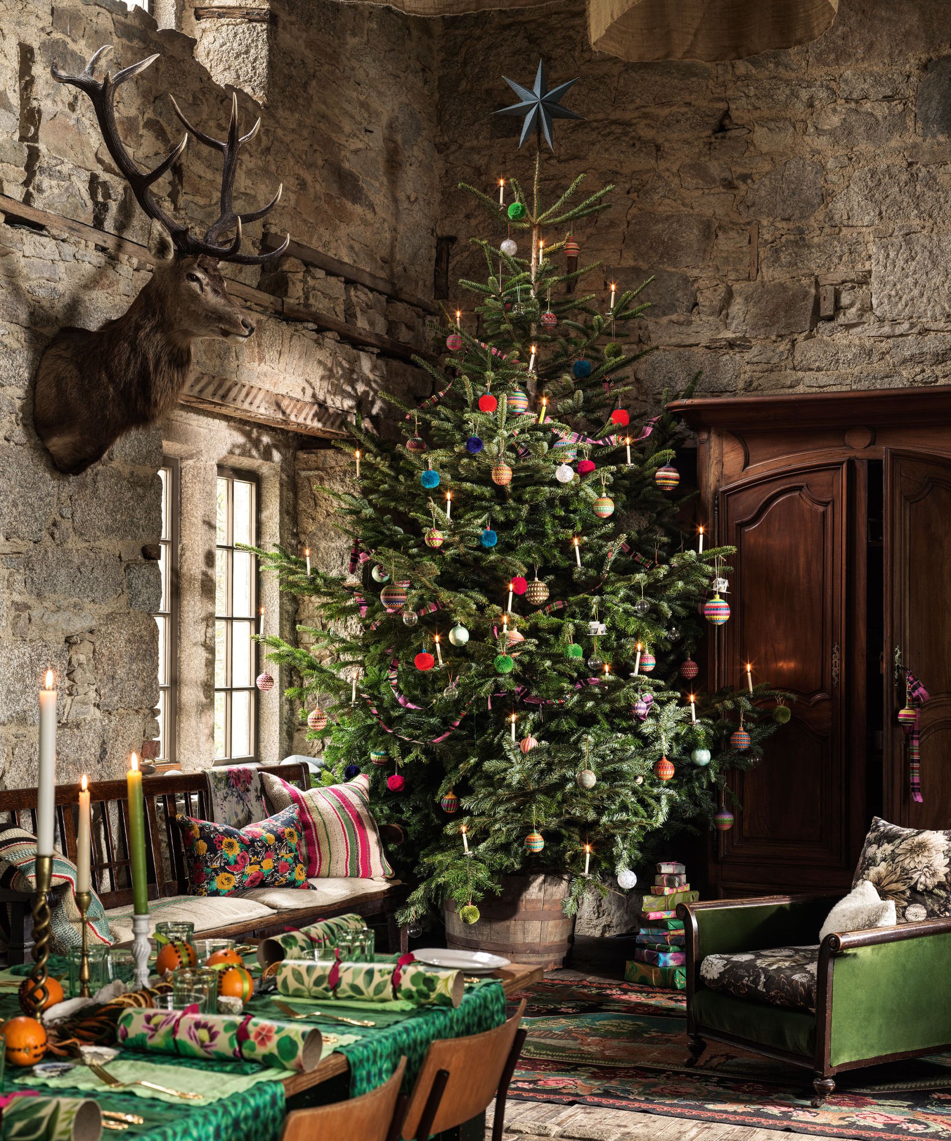 Large dining room with tall christmas tree and christmas dining table