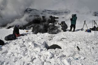 Digging a snow pit near a lava flow at Russia's Tolbachik volcano in April 2013.
