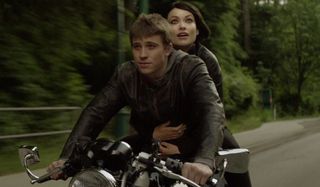 Tron Legacy Sam and Quorra riding on a motorcycle