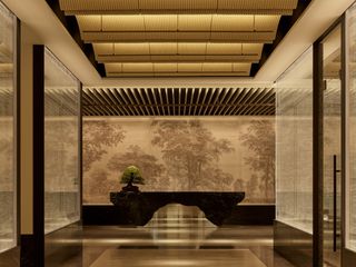 Japanese-style reception with a bonsai tree area at Janu Tokyo