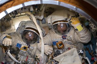 Cosmonauts Alexander Misurkin (left) and Anton Shkaplerov are pictured in their Russian Orlan spacesuits during a fit check on Jan. 31, 2018.